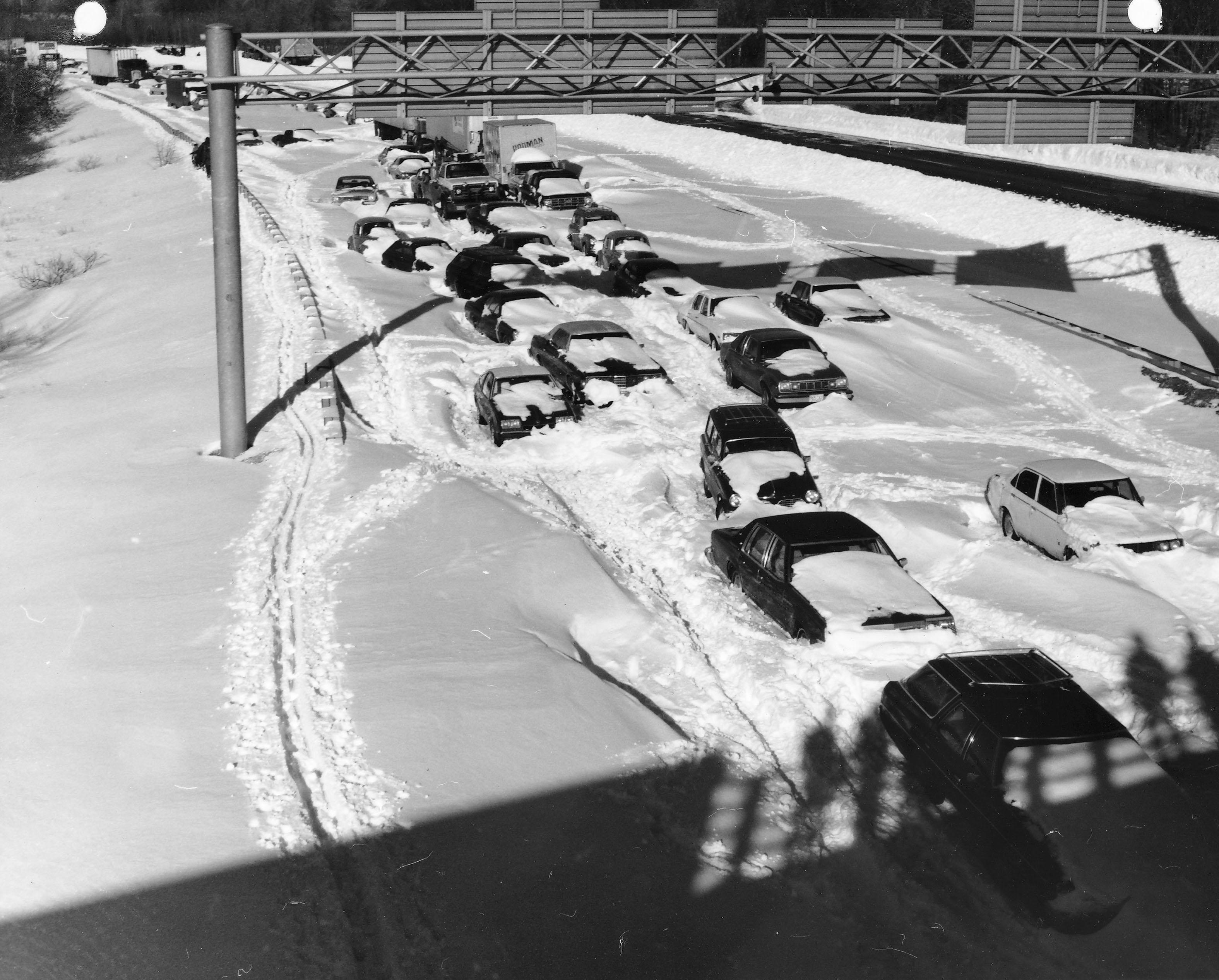 Cars abandoned in deep snow on Massachusetts Route 128 South near Needham following the February 1978 blizzard. Photographed by Jim McDevitt for the U.S. Army Corps of Engineers.